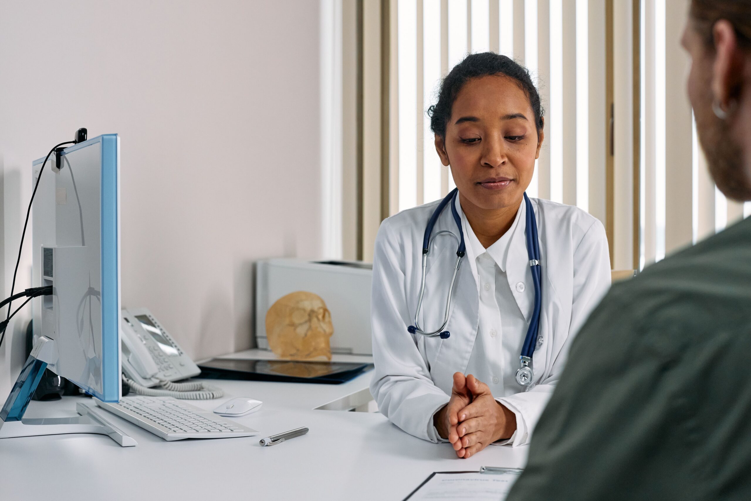 Physician consulting with a patient during an unhurried office visit, illustrating Direct Primary Care versus concierge medicine