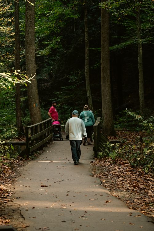 Family walking outdoors, representing direct primary care healthy lifestyle