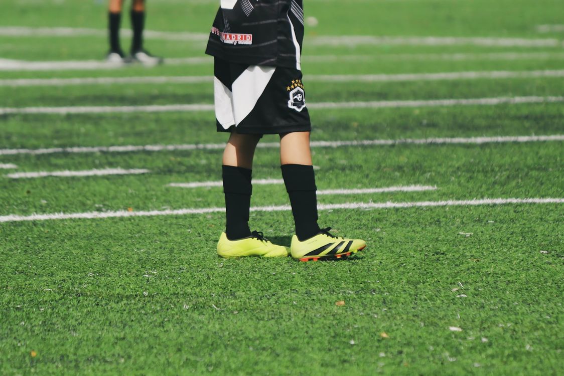 Youth soccer player on field, sports physicals for kids